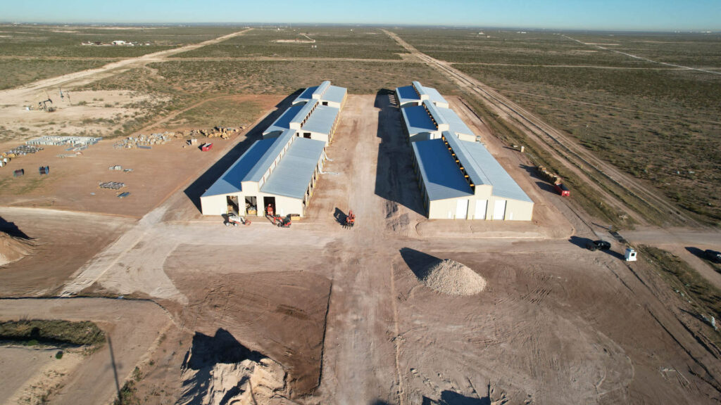 an aerial view of a large building in the middle of nowhere
